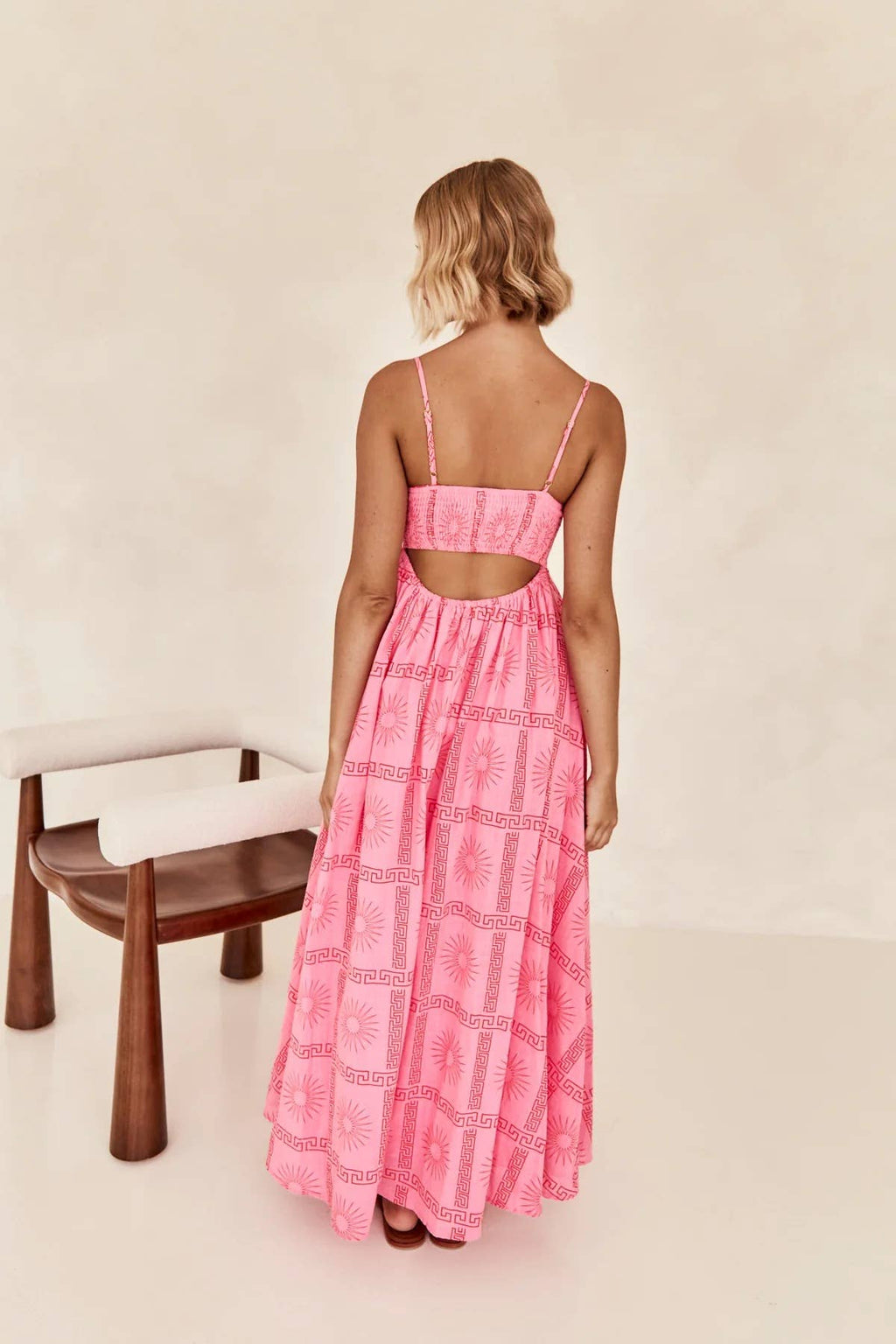 Printed and distinctive back-cut halter dress
