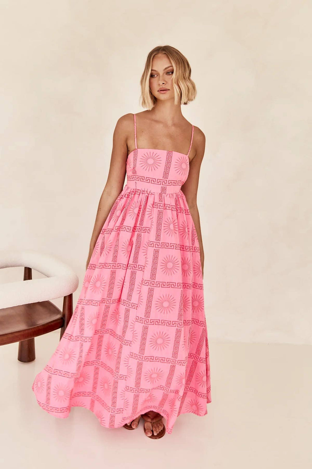 Printed and distinctive back-cut halter dress